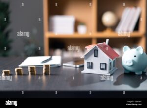 maison moderne avec cle et calculatrice