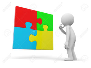 personne reflechissant devant plusieurs pieces de puzzle